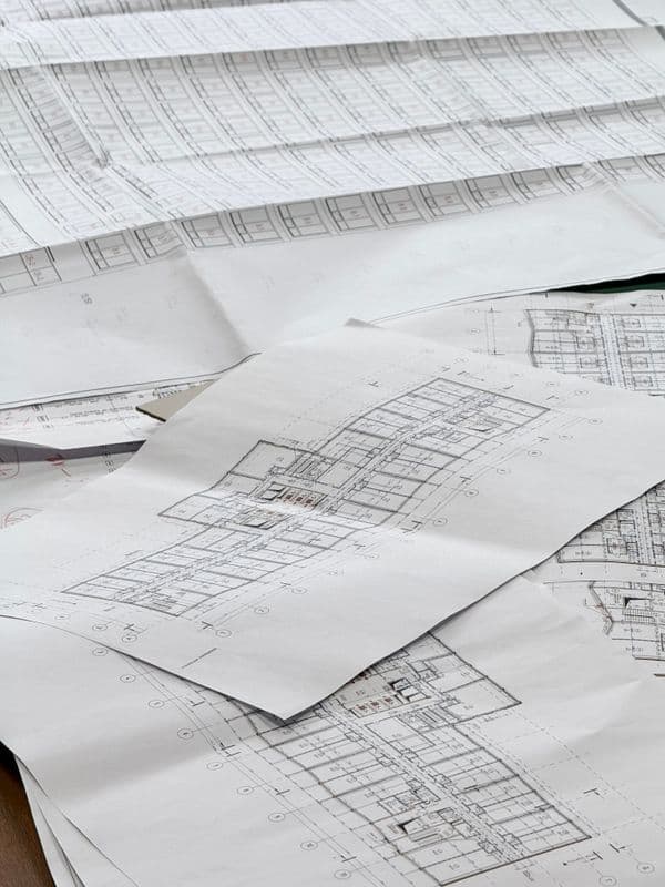 Architectural blueprints and plans on a desk